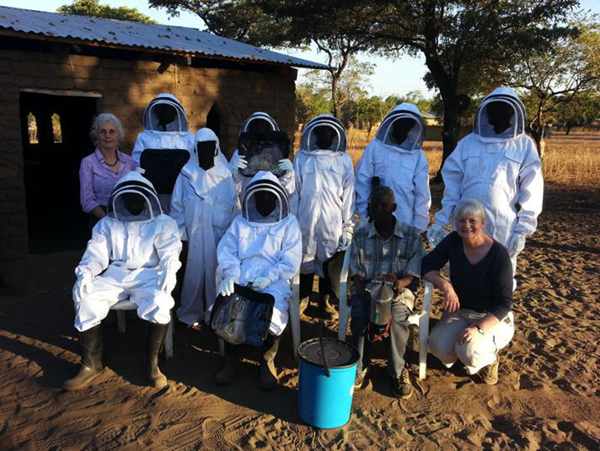 Beekeeping team in new bee suits Beekeeping team in new bee suits
