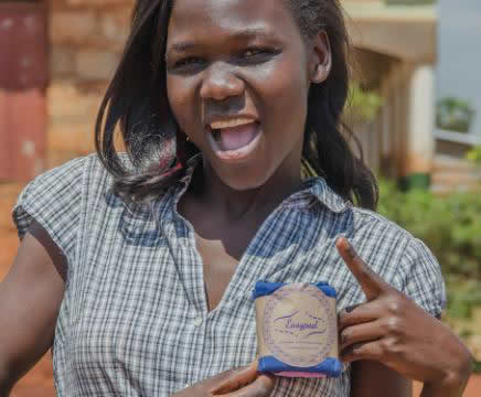 Susan, a co-founder and board member of Irise Uganda Ltd poses with the product Susan, a co-founder and board member of Irise Uganda Ltd poses with the product